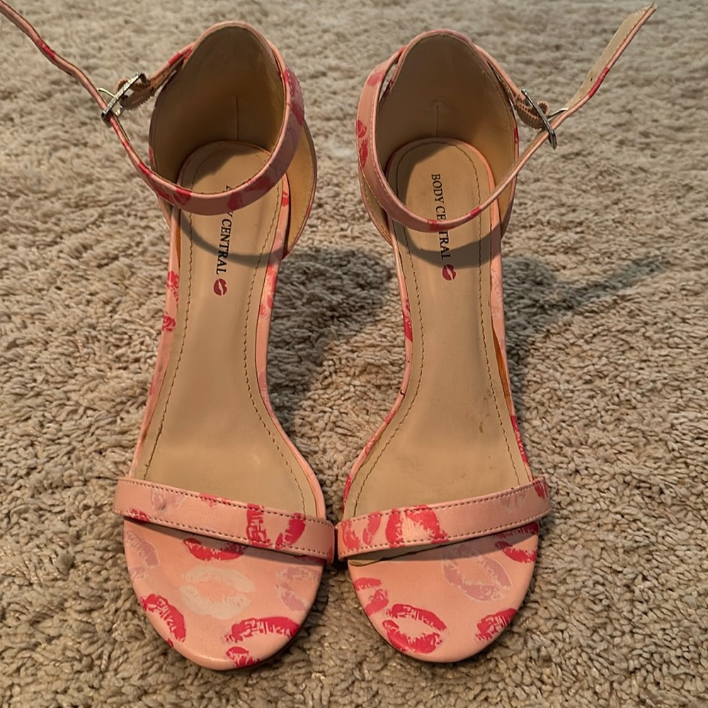 Pink heels with lips on them size 8.5 body central worn once inside only